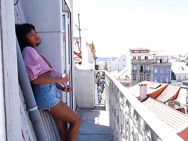 Exotic beauty Angel Constance balcony solo strip and posing