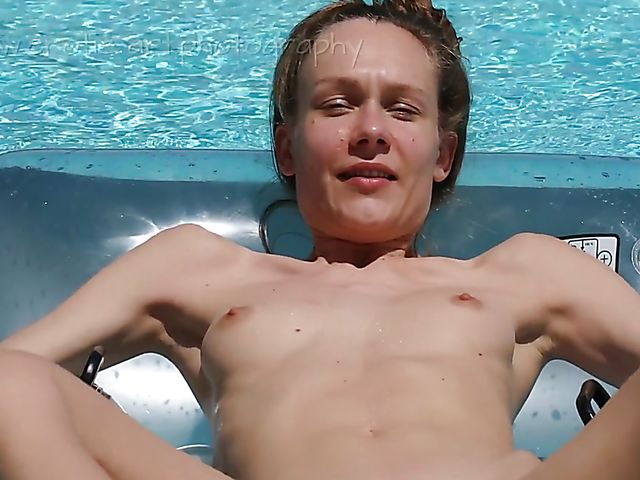 Skinny nude girl Mira outdoor fingering solo in the pool on a sunny day