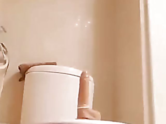 Shaved Japanese amateur rides her dildo in the bathroom