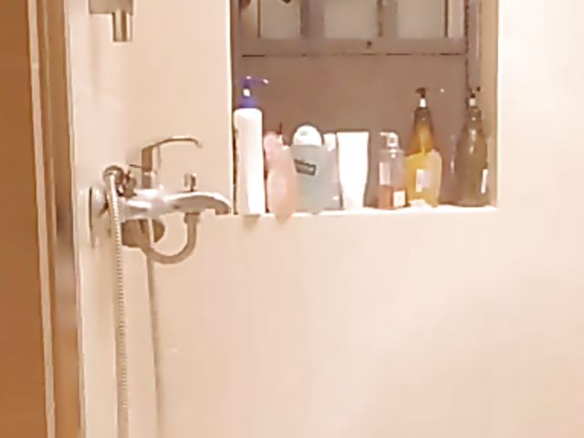 Shaved Japanese amateur rides her dildo in the bathroom