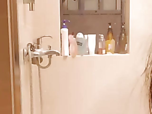 Shaved Japanese amateur rides her dildo in the bathroom