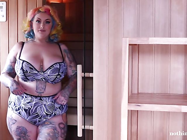 Tattooed BBW Galda Lou takes a shower and displays her heavy tits in the sauna