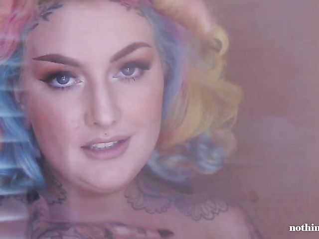 Tattooed BBW Galda Lou takes a shower and displays her heavy tits in the sauna