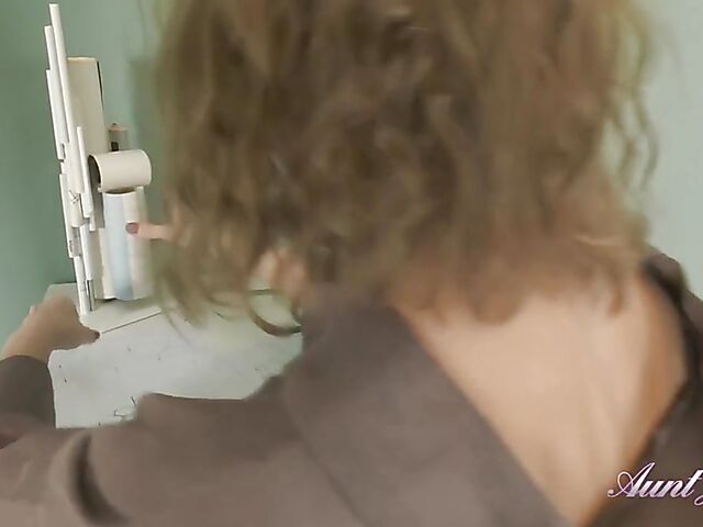 Curly slim MILF with glasses Irena rubs her shaved cunt softly