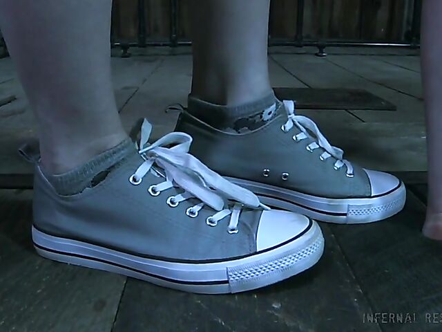 Strap-on from behind and caning punishment for helpless Claire Adams with heavily pierced pussy lips