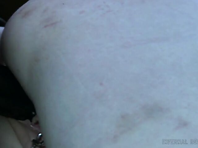 Strap-on from behind and caning punishment for helpless Claire Adams with heavily pierced pussy lips