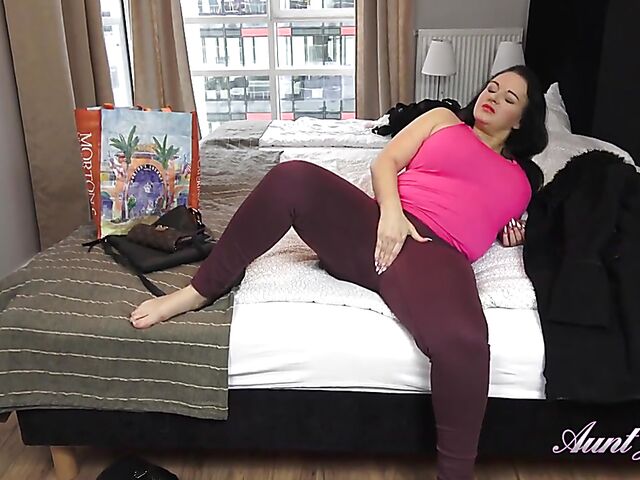 Thick mom Devon strokes her pussy on her bed