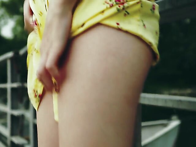 Skinny redhead in heels Elin Flame takes off her dress and shows her snatch outdoors