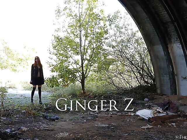 Redhead in leather Ginger Z has fun with her inflatable dildo