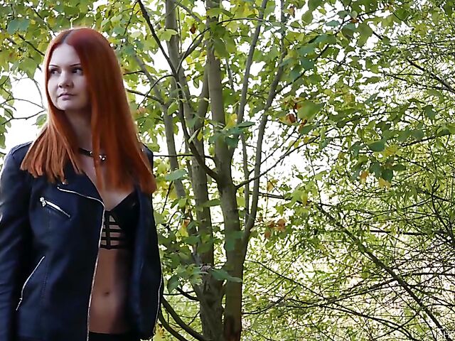 Redhead in leather Ginger Z has fun with her inflatable dildo