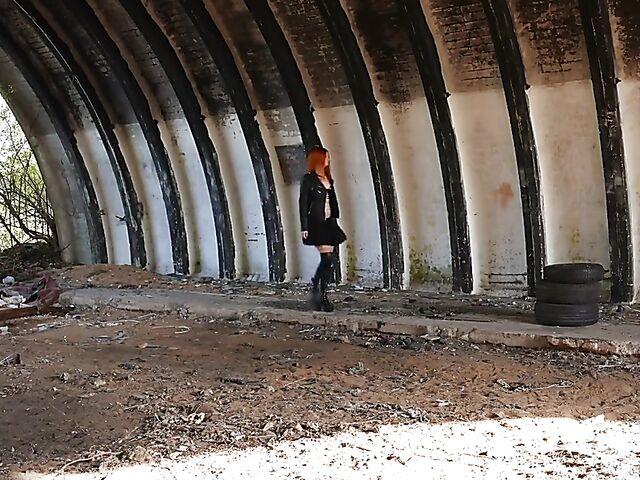 Redhead in leather Ginger Z has fun with her inflatable dildo