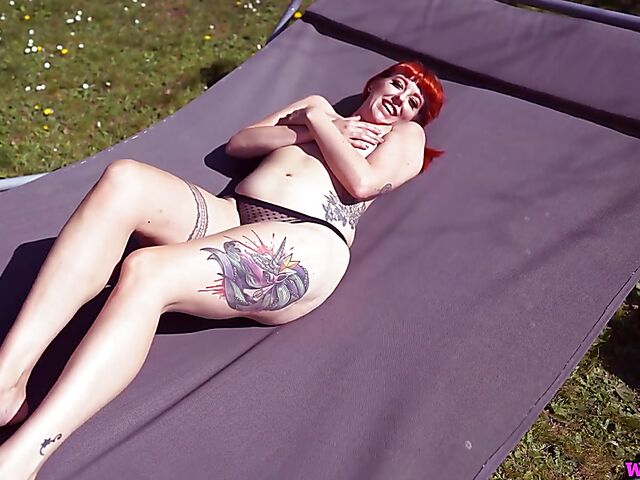 Redhead tattoo girl with tiny boobs Auburn Fox gets caught topless in the garden and shows her twat 