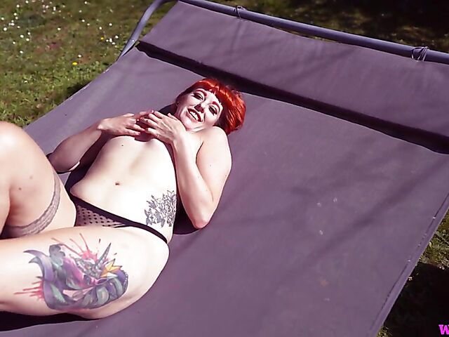 Redhead tattoo girl with tiny boobs Auburn Fox gets caught topless in the garden and shows her twat 
