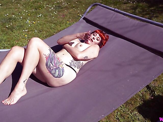 Redhead tattoo girl with tiny boobs Auburn Fox gets caught topless in the garden and shows her twat 