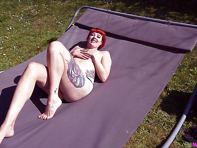 Redhead tattoo girl with tiny boobs Auburn Fox gets caught topless in the garden and shows her twat 