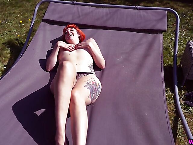 Redhead tattoo girl with tiny boobs Auburn Fox gets caught topless in the garden and shows her twat 