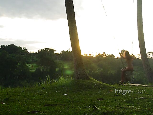 Nude art shoot backstage with Clover swinging outdoors in Bali
