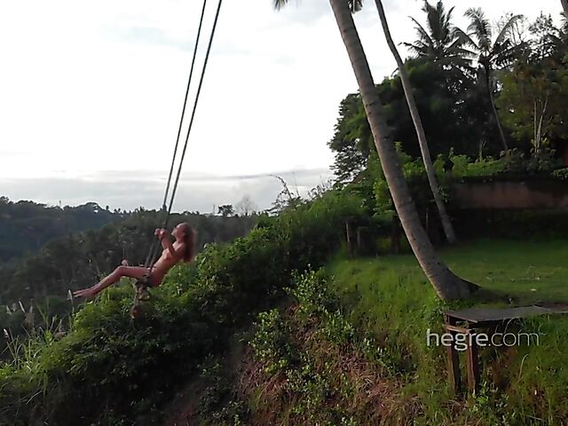 Nude art shoot backstage with Clover swinging outdoors in Bali