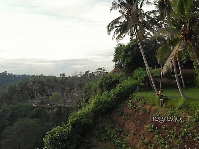 Nude art shoot backstage with Clover swinging outdoors in Bali