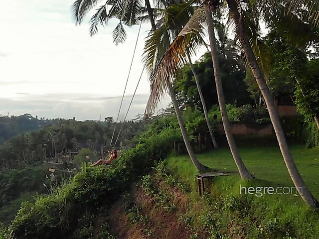 Nude art shoot backstage with Clover swinging outdoors in Bali