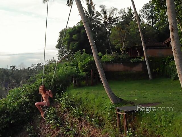 Nude art shoot backstage with Clover swinging outdoors in Bali