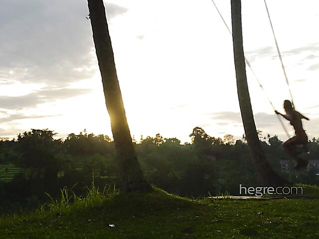 Nude art shoot backstage with Clover swinging outdoors in Bali