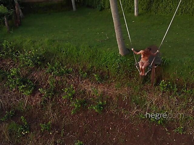 Nude art shoot backstage with Clover swinging outdoors in Bali