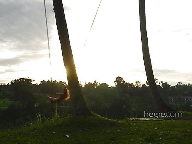 Nude art shoot backstage with Clover swinging outdoors in Bali