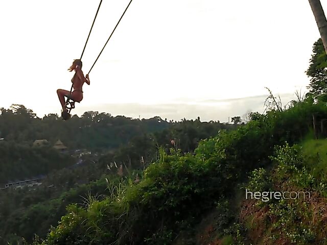 Nude art shoot backstage with Clover swinging outdoors in Bali