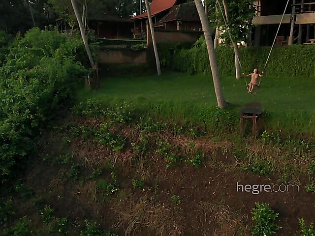 Nude art shoot backstage with Clover swinging outdoors in Bali