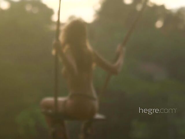 Nude art shoot backstage with Clover swinging outdoors in Bali