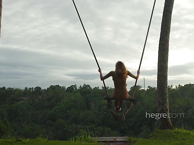 Nude art shoot backstage with Clover swinging outdoors in Bali
