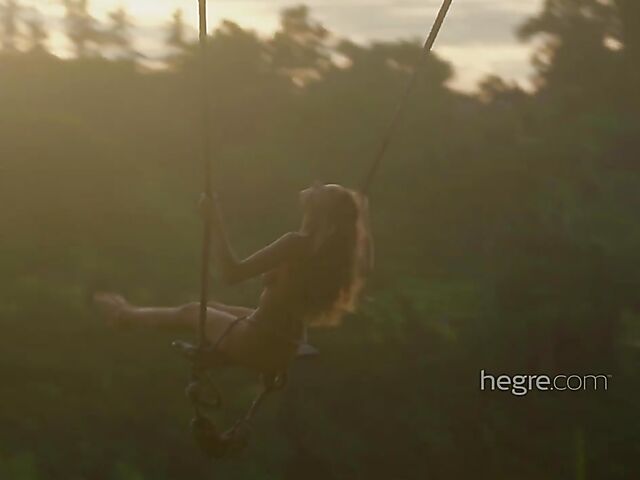 Nude art shoot backstage with Clover swinging outdoors in Bali
