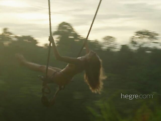 Nude art shoot backstage with Clover swinging outdoors in Bali