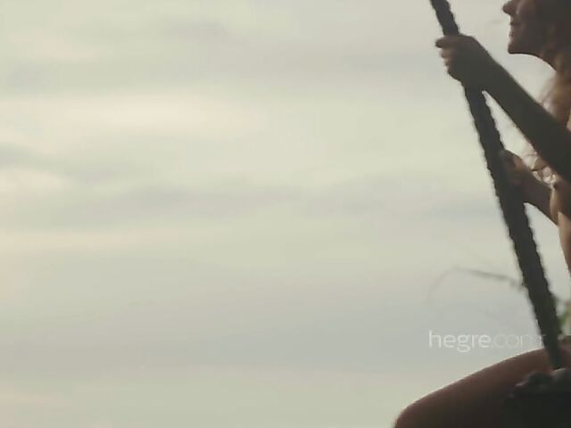 Nude art shoot backstage with Clover swinging outdoors in Bali