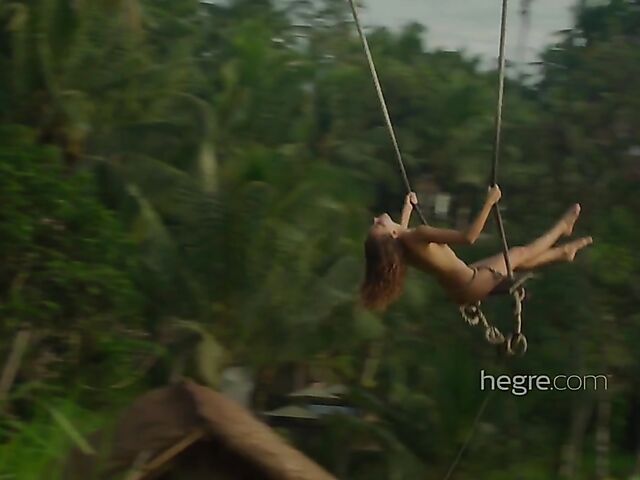 Nude art shoot backstage with Clover swinging outdoors in Bali