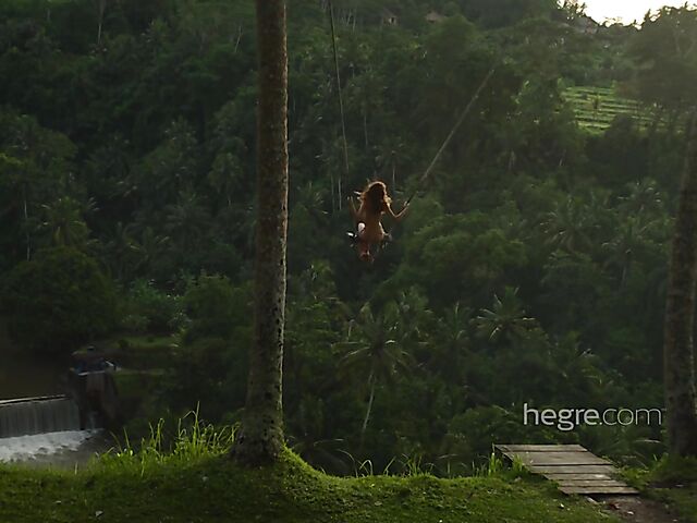 Nude art shoot backstage with Clover swinging outdoors in Bali