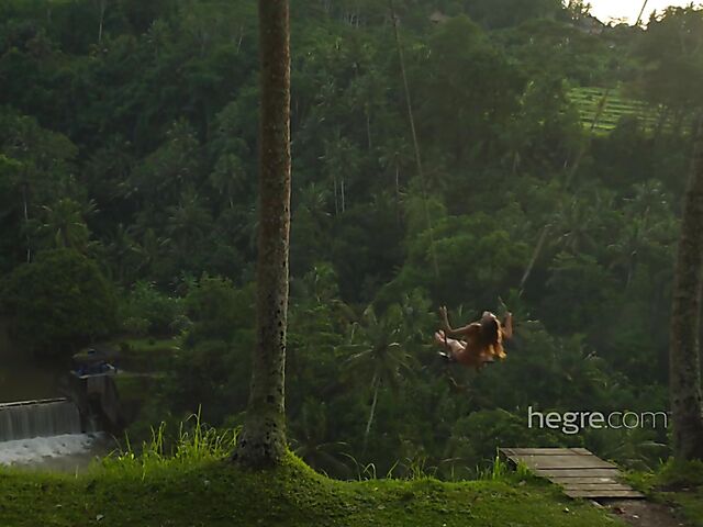 Nude art shoot backstage with Clover swinging outdoors in Bali