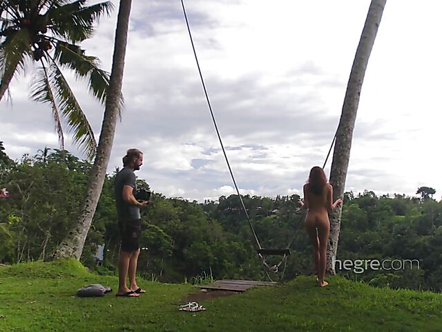 Nude art shoot backstage with Clover swinging outdoors in Bali