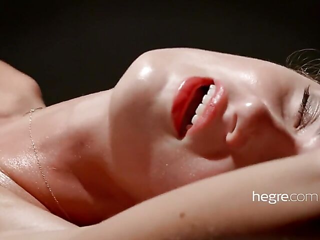 Erotic massage with legs wide open on a gyno chair