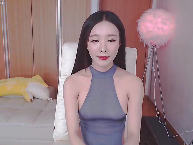 Chinese webcam beauty shows her firm boobs and rubs her mound in her black panties