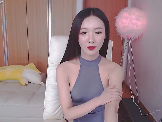 Chinese webcam beauty shows her firm boobs and rubs her mound in her black panties