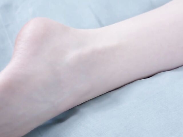 Skinny pale redhead Lottie Magne fingering her snatch in bed