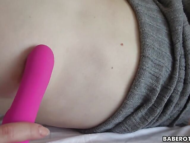 Petite solo chick Candy Black masturbates in her bed with her pink vibrating dildo