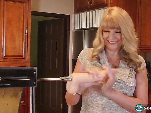 Blonde mature Mia Magnusson loves fucking machines