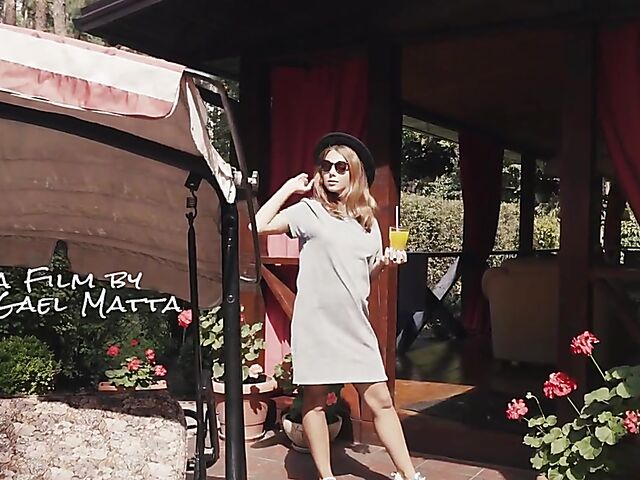 Met Art model with sunglasses Belka stripping and smoking in the garden