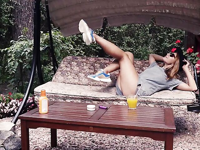 Met Art model with sunglasses Belka stripping and smoking in the garden