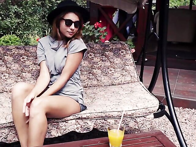 Met Art model with sunglasses Belka stripping and smoking in the garden