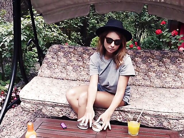 Met Art model with sunglasses Belka stripping and smoking in the garden