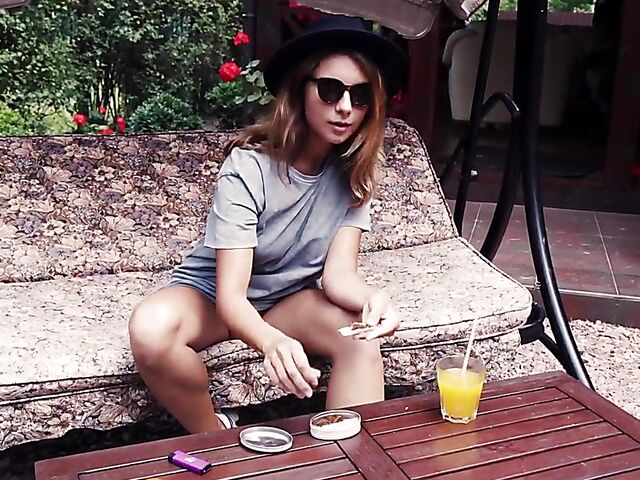 Met Art model with sunglasses Belka stripping and smoking in the garden